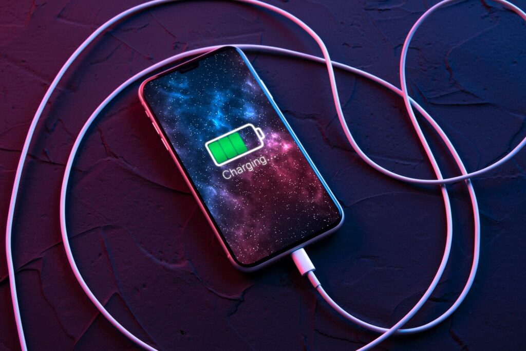 Mobile smart phone wireless charging device dark neon red blue color background icon battery charging progress lighting screen smartphones connected power source low battery 150455 13833 Mobile smart phone wireless charging device dark neon red blue color background icon battery charging progress lighting screen smartphones connected power source low battery 150455 13833