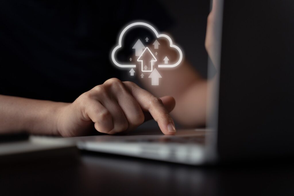 Woman using laptop upload with cloud icon hologram effect 105092 945