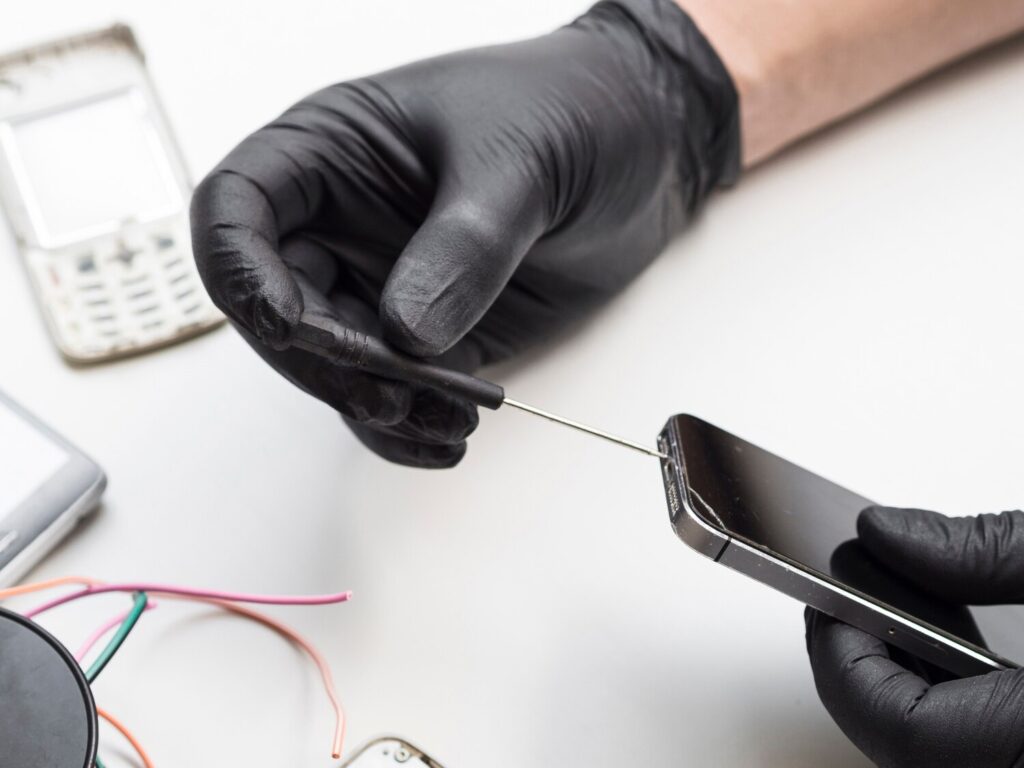Man using screwdriver phone 23 2148254147 Man using screwdriver phone 23 2148254147