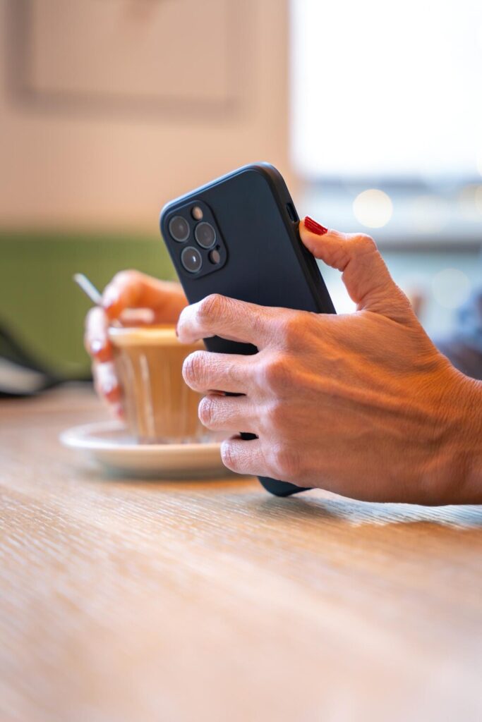 Unrecognizable caucasian business woman using app her smartphone cafe vertical 543206 236 Unrecognizable caucasian business woman using app her smartphone cafe vertical 543206 236